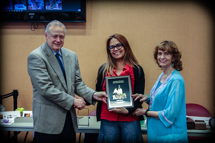 From left to right: Tom Crane, Texas Chess Association President; Christina Fidaire; and Maritta Del Rio Sumner, Distinguished Visitor. Photo by Sheryl Mc Broom at North Richland Hills Library.