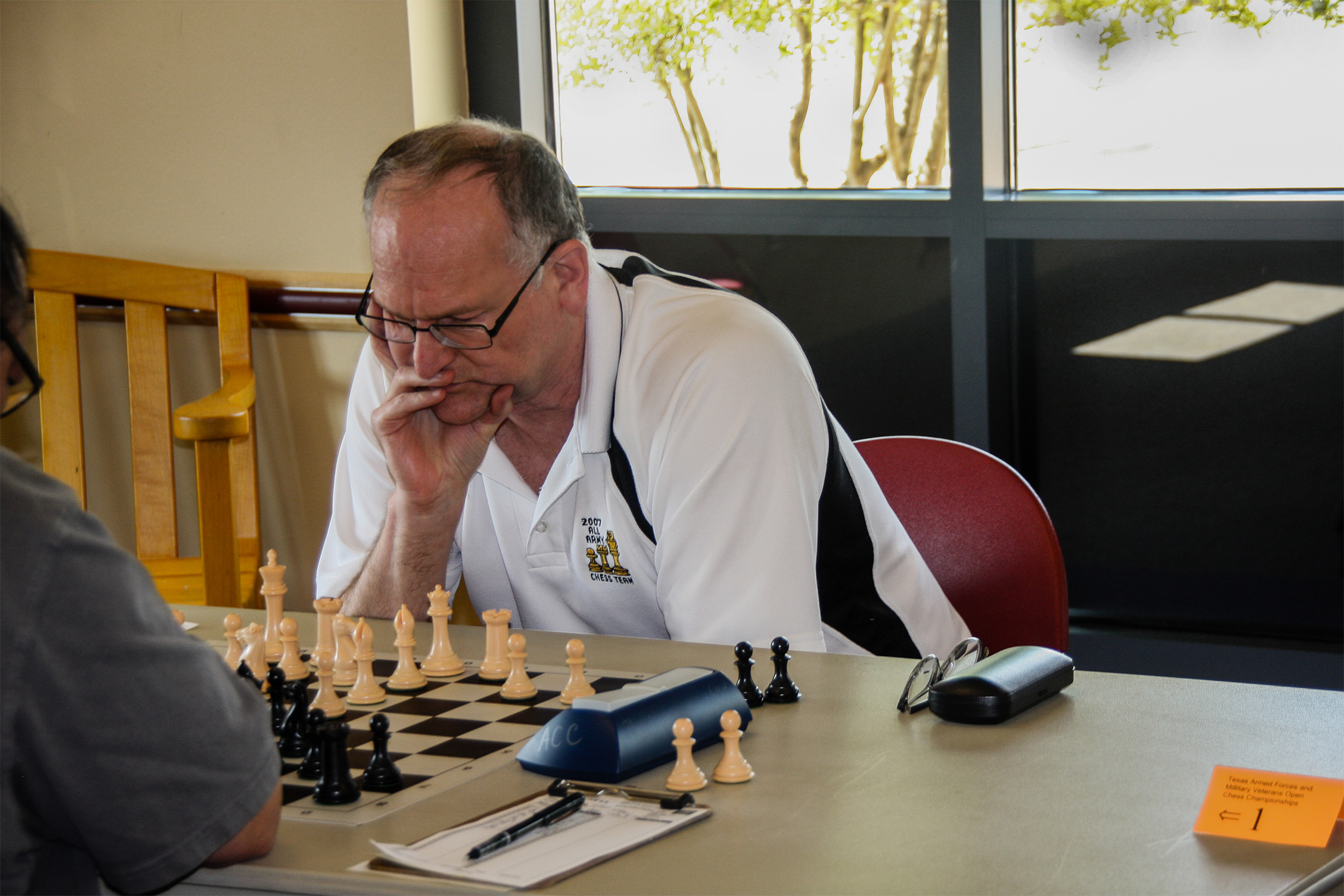 Army Retiree Mike Donovan was out-of-country and could not play.  However, he did the next best thing and called via Skype to wish everyone well.  Photo from Round 2 of the 2017 Texas Armed Forces and Military Veterans Open Chess Championships by Danny Dunn.