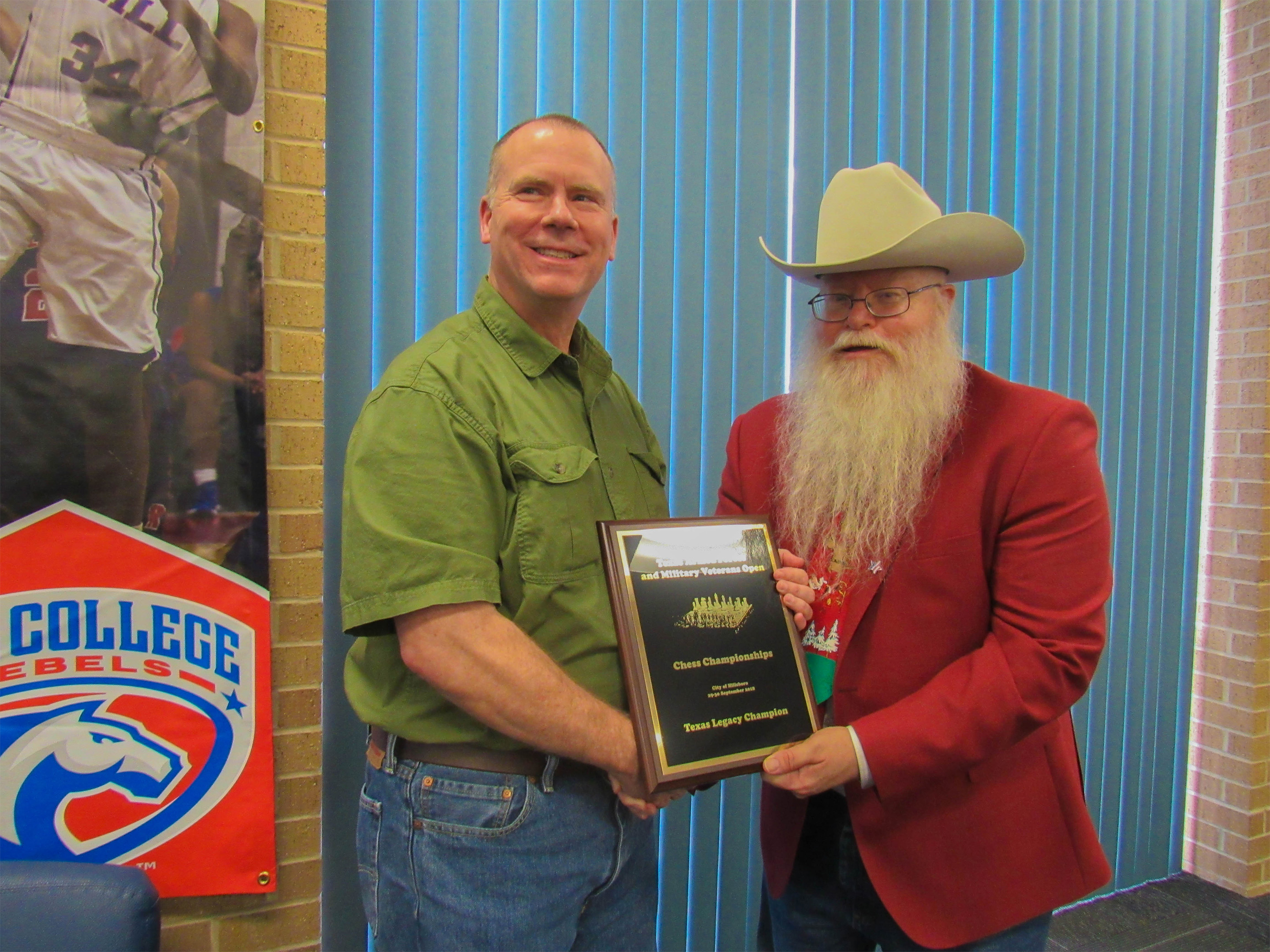 Army Veteran and Chess Expert Ron Farrar (left in the photo) is awarded the title of Texas Legacy Champion by Chief Organizer Jim Hollingsworth (right).  Photo by Sheryl McBroom.