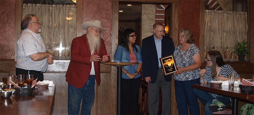 Heart of Texas Award ceremony at Women's Banquet -- From Left to right:  Jeff French, Assistant TD; Jim Hollingsworth, Chief Organizer and TD; WCM Claudia Munoz, TCA Region 1 Director; Tom Crane, TCA Region 2 Director; Barb Swafford, Honoree; Rheanna English (seated)
