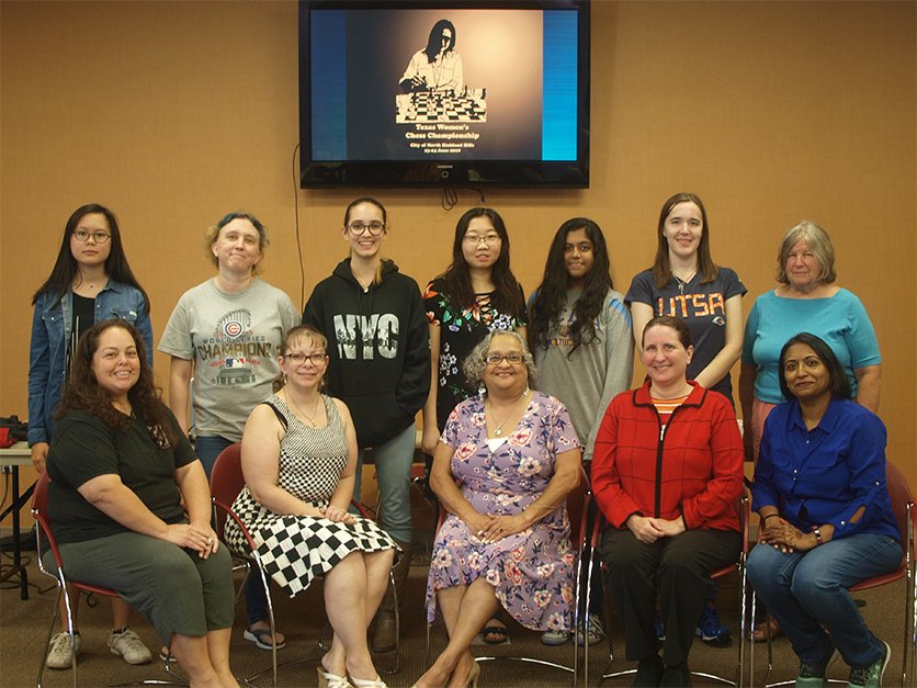 Seated (left to right) are Margaret Bailon-Labednick (from Corpus Christi), Wendy Reed (from Roanoke), Clarese Roberts (from Fort Worth), Woman International Master and National Chess Master Dr. Alexey Root (from Denton), and Sheba Basepogu (from Allen). Standing (from left to right) are Woman Candidate Master Camille Kao (from Austin), Nicole Niemi (from Garland), Ambriette Reed (from Roanoke), Yue Chu (from Plano), Woman FIDE Master and National Chess Expert Devina Devagharan, Rheanna English (from San Antonio), and Barb Swafford (from Crowley).