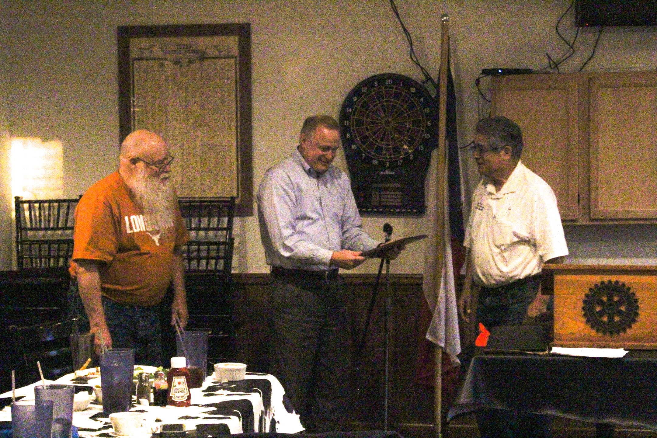 Tom Crane (center) receives the National Chess Master Bill Wall Texas Legacy award from Carmen Chairez (right).  Jim Hollingsworth (left) looks on.  Photo by Sheryl McBroom.