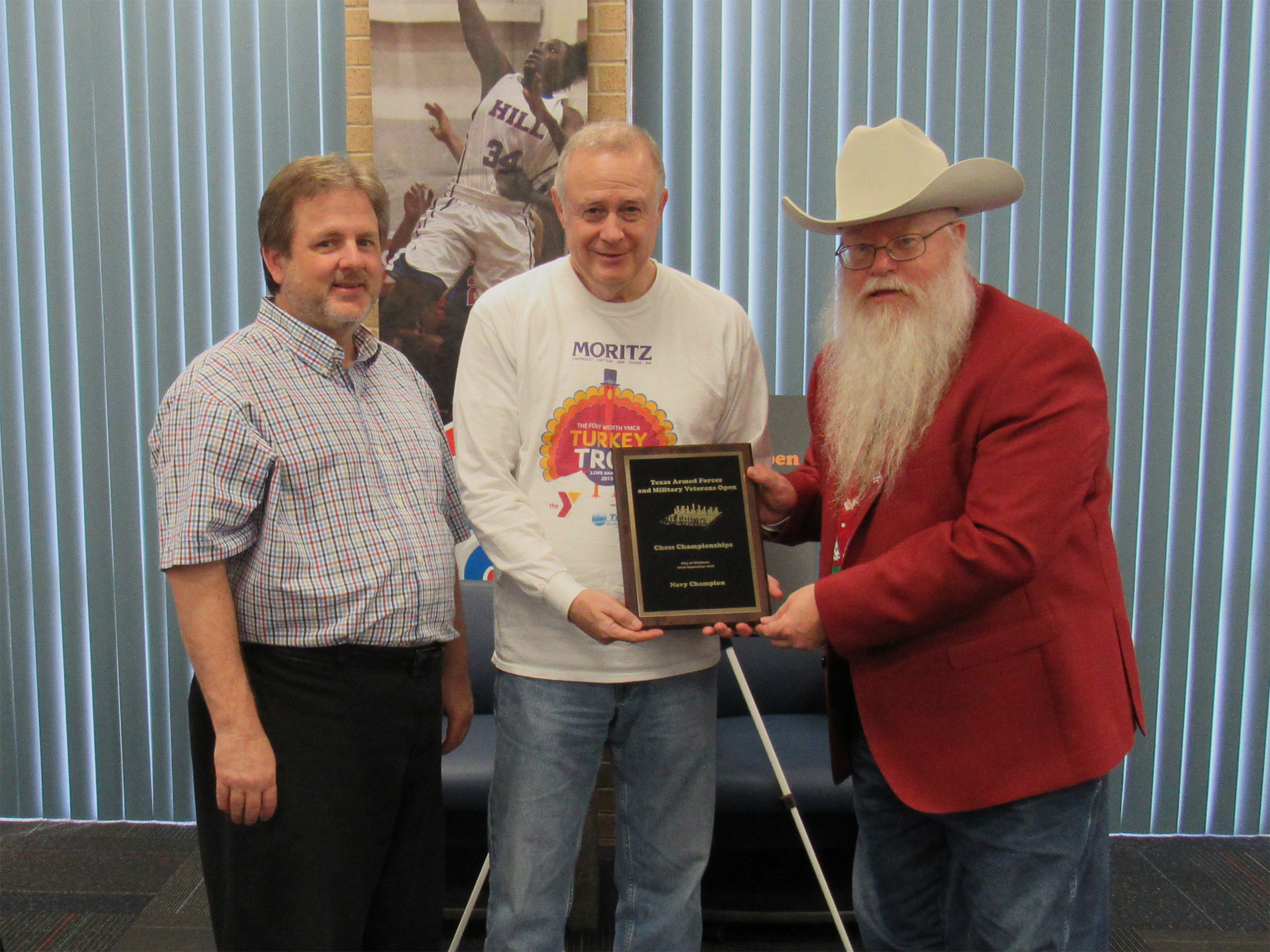 Chief Tournament Director Chris Wood (left) and Chief Organizer Jim Hollingsworth (right) award the title of Texas Armed Forces Navy Champion to Tom Crane (center).  Photo by Sheryl McBroom.